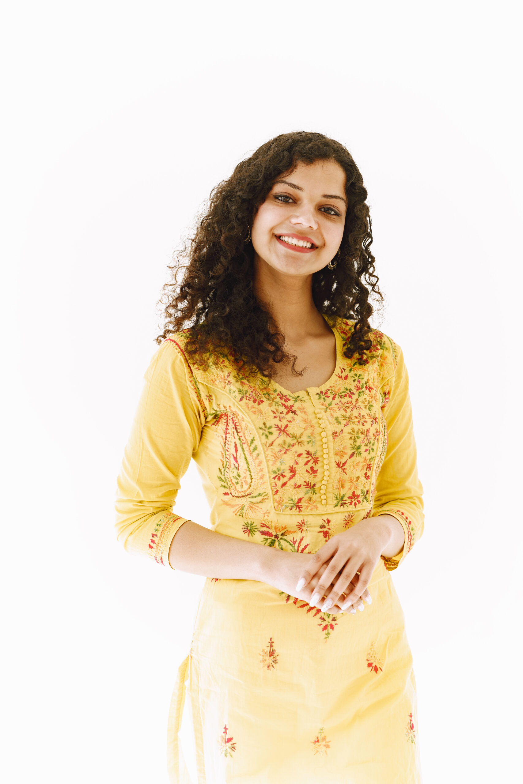 cheerful traditional indian woman white background studio shot scaled
